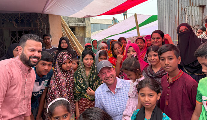 Sam and Evan taking group photo with kids of Mohakhali slum Dhaka, Bangladesh